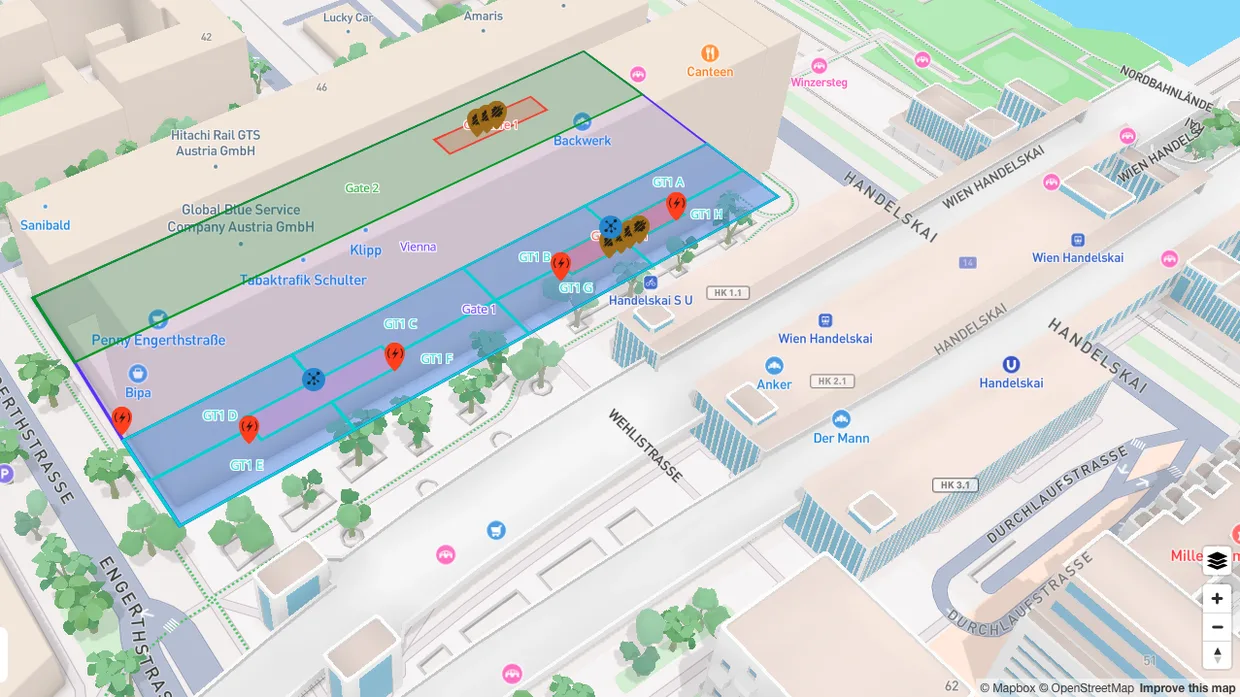 FacilityUp.Space screen: a 3D city map with a building divided into colour-coded zones and device pins.